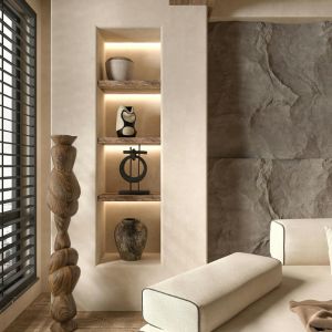 Vue intérieure du salon d'une maison, avec canapé sur lequel architecte et clients discuteront des plans d’une maison en construction.